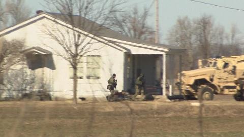 Special Response Team MRAP Vehicle approaching house