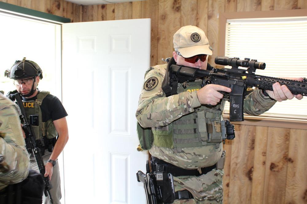 Special Response Team members entering a house
